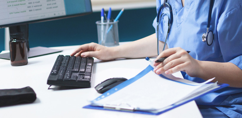 A healthcare worker with documents